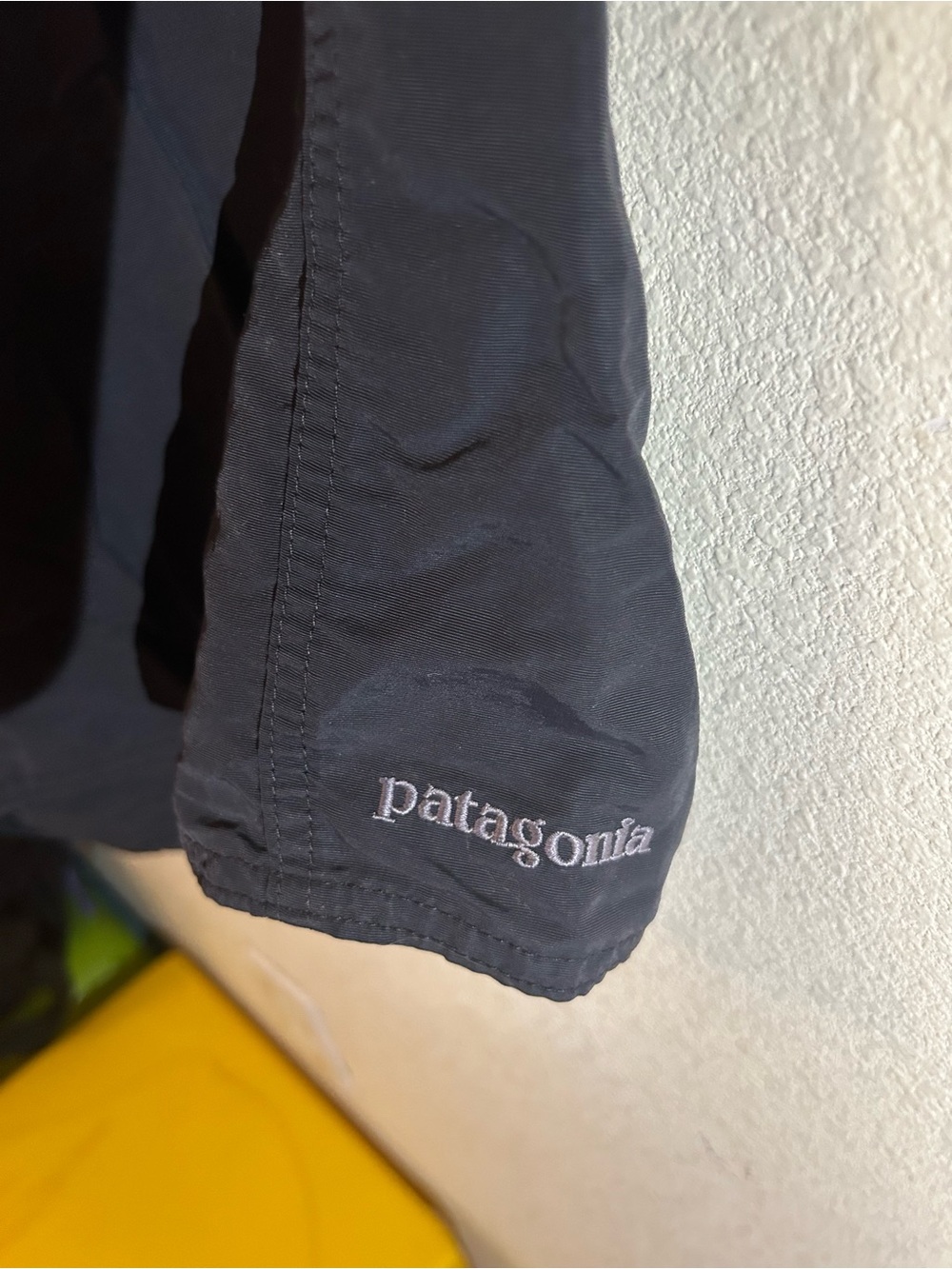 Patagonia black jacket with white embroidered logo